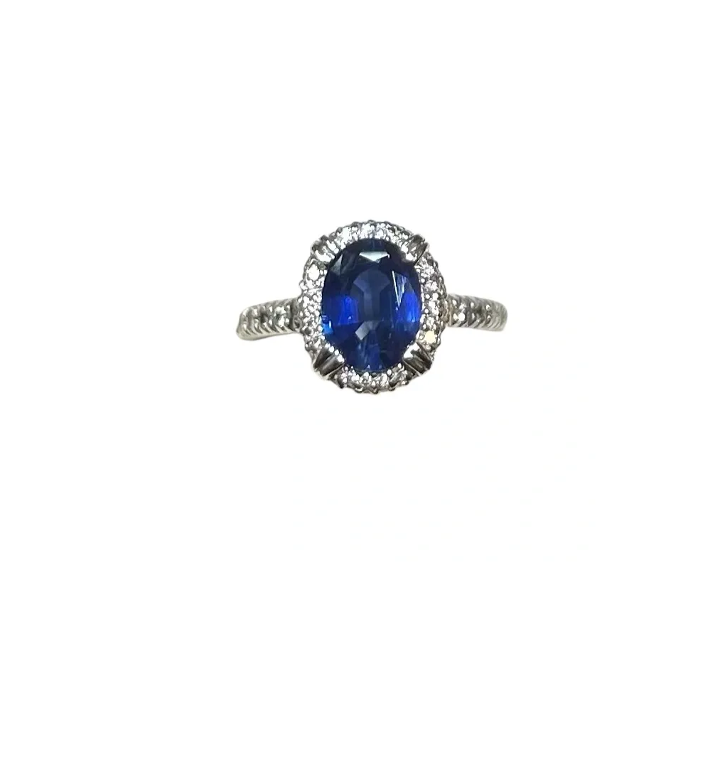 Oval sapphire three-stone diamond ring